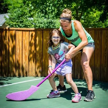 Meghan-Teaching-Little-Girl-Jr-Hockey-JPEGHigh-370px