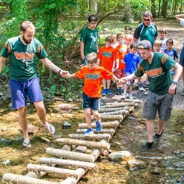 Pioneering-Boys-With-Staff-Crossing-Bridge-JPEGHigh-370px