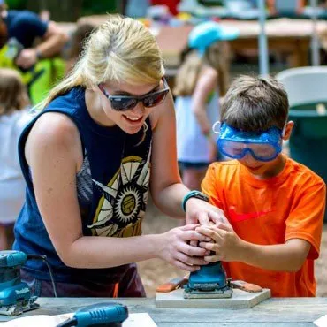 Woodworking-Boy-With-Staff-Sanding-JPEGHigh-370px